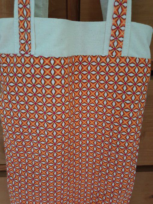 Sac à baguettes ou pains orange fleurs blanche 